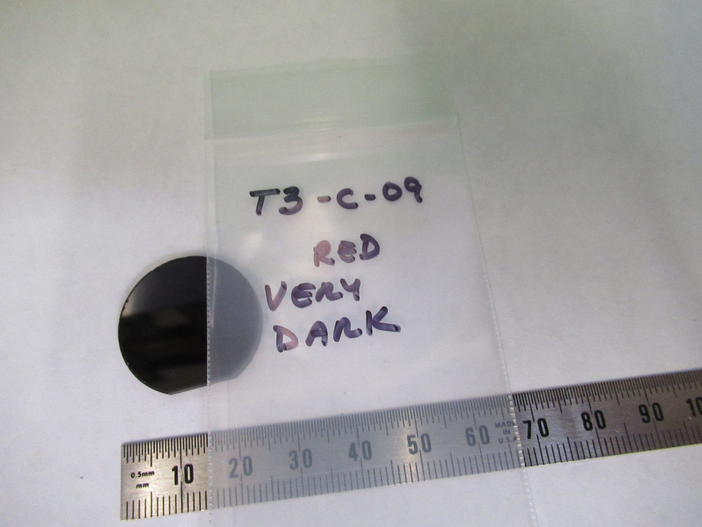 OPTICAL GLASS CIRCULAR VERY DARK RED FILTER OPTICS AS PICTURED T3-C-09